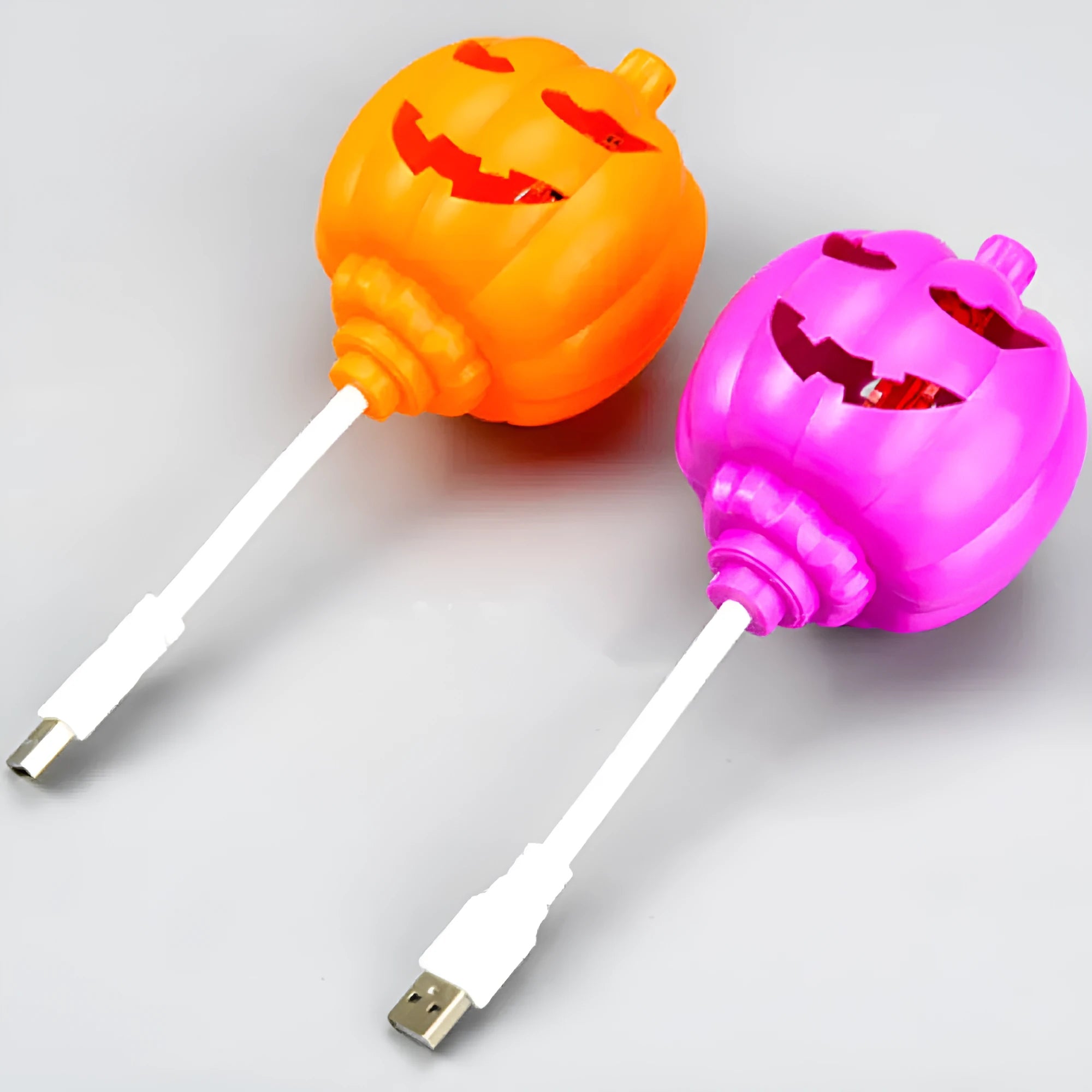 Plastic pumpkin lamp with USB charging cable in yellow or purple light colour