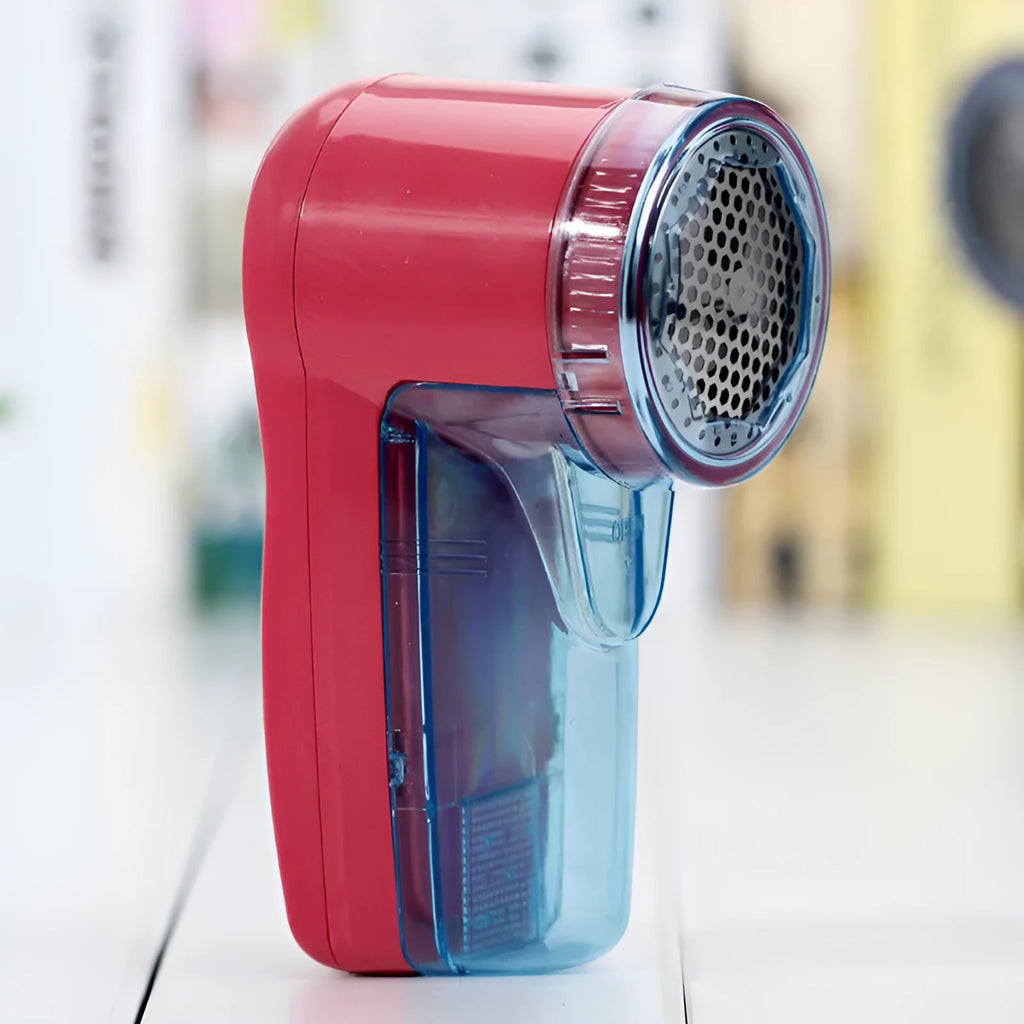 Portable electric lint remover unit showing compact design with collection compartment