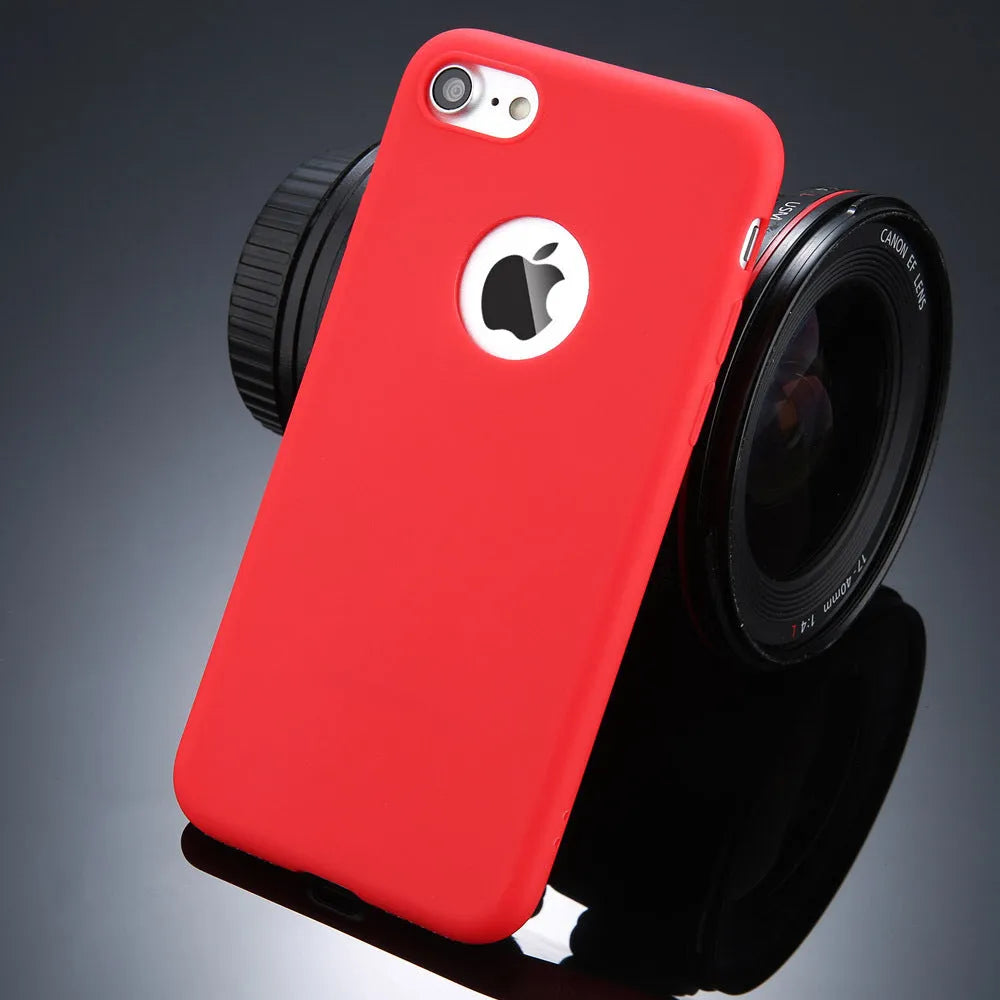 Candy colour soft silicon TPU back cover case for iPhone on a plain background.