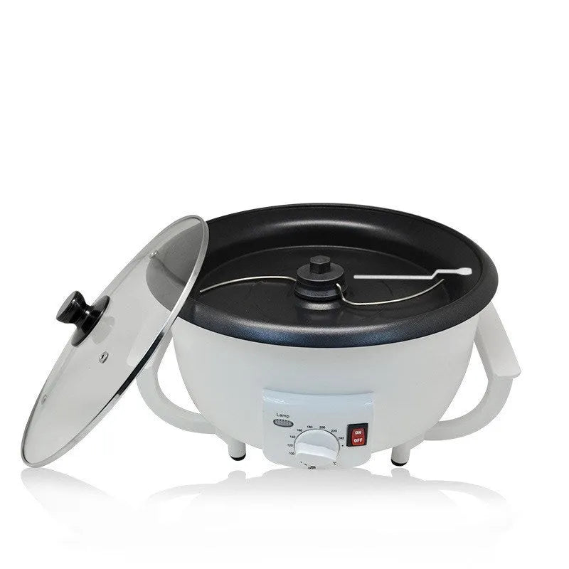 White electric coffee bean roasting machine with 750g capacity and oblate drum design on kitchen counter