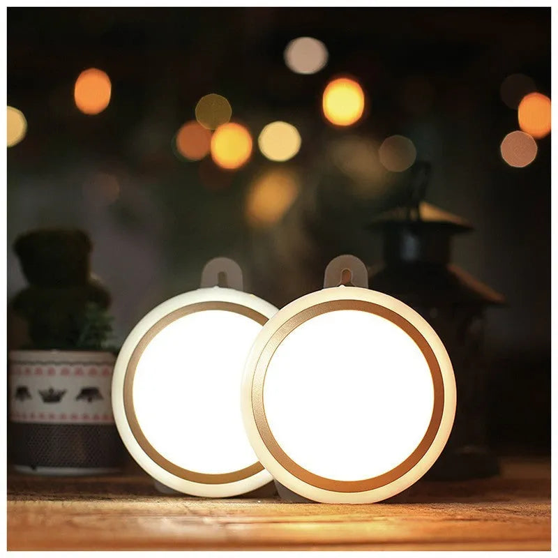 Round white motion sensor LED light unit with 80mm diameter, for cupboard or wall mounting.