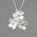 Myosotis Sylvatica sterling silver floral pendant in pastoral style, showing gold and silver colour options.