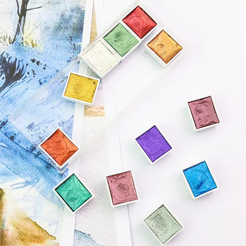 Box of solid watercolour pigment cakes in gem, pearl, or starlight colours for painting and nail art.