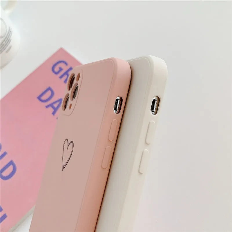 Silicone phone case for Apple iPhones in multiple solid colours including black, white, and pastel options