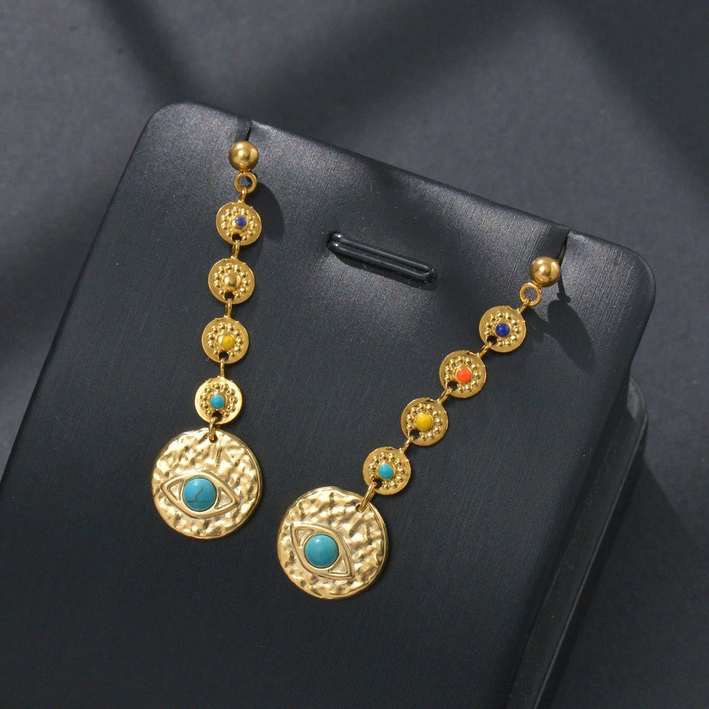 Geometric stainless steel drop earrings showing star, eye and shell sun designs for pierced ears