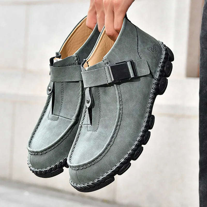 Handmade casual slip-on shoes in black, brown, or green with a flat heel and stitched sole.
