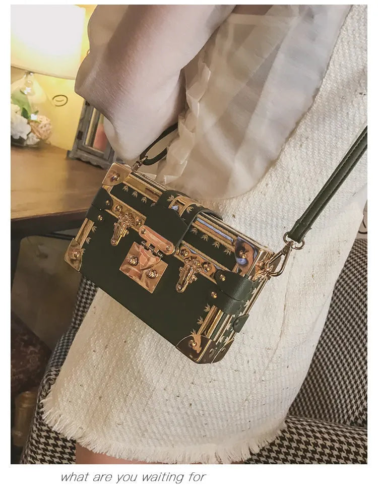 Black PU hard-sided women's shoulder bag with flap closure and decorative rivets