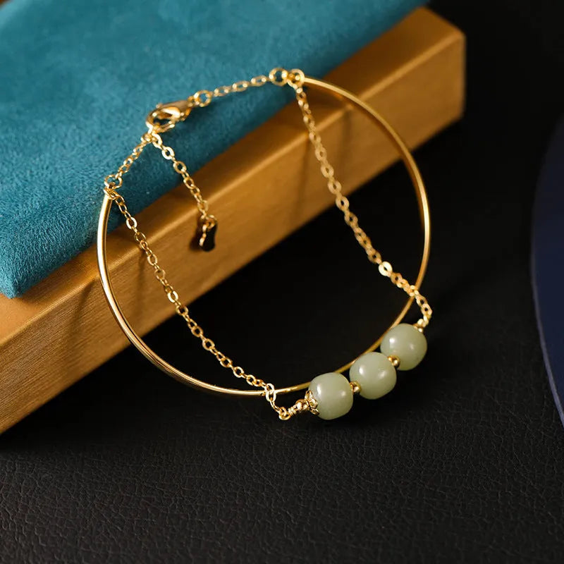 Women's jade bracelet with gold inlay detailing showing single, double and three bead versions