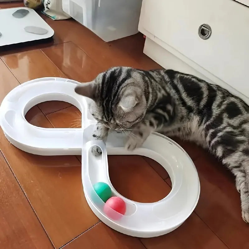 Blue and white cat turntable toy with ball track and teasing stick on wooden floor