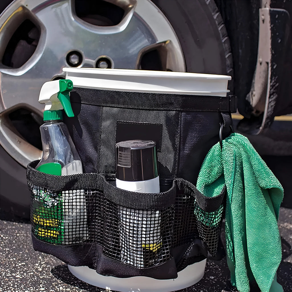 Black cylindrical polyester hanging storage bag on a 5 gallon drum