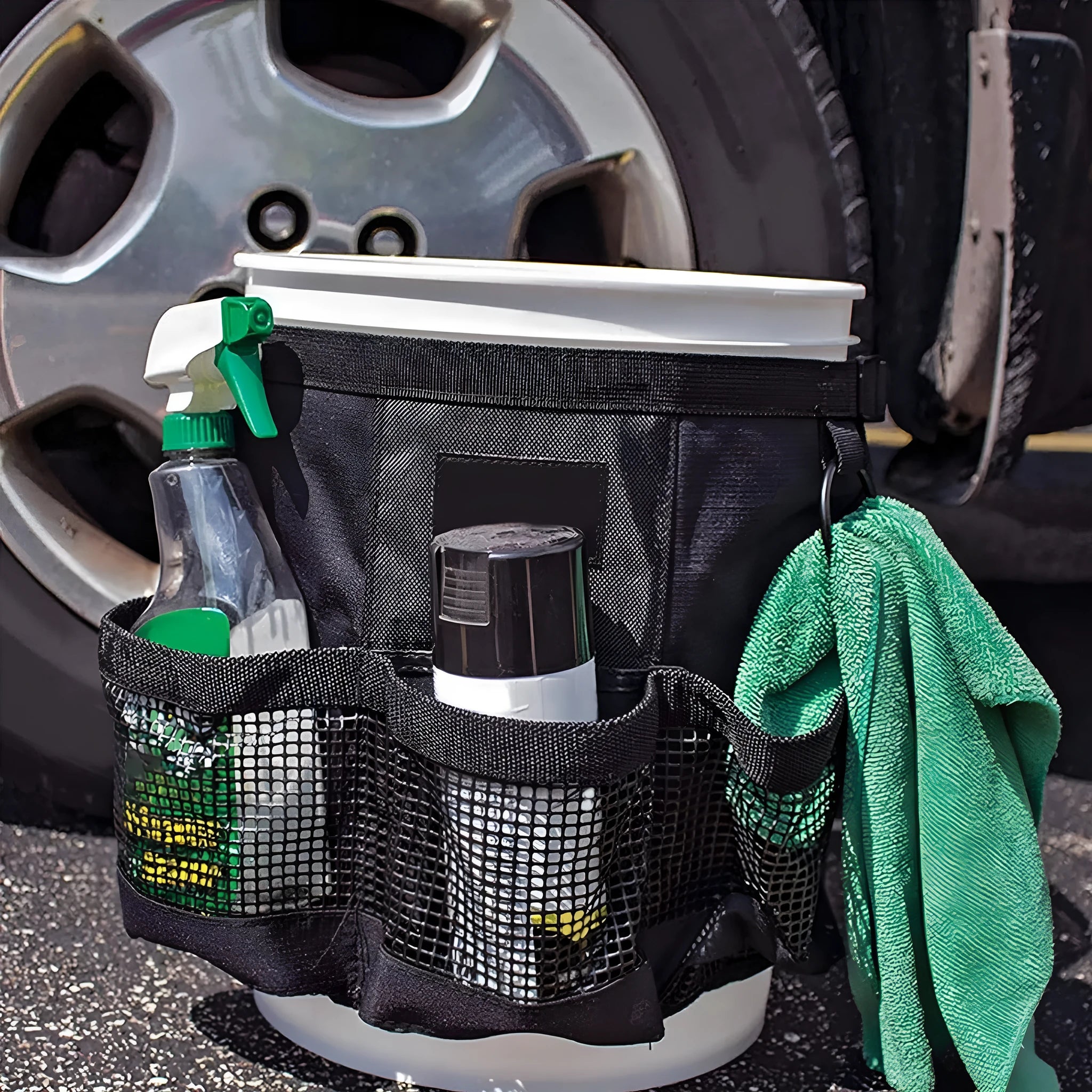Black cylindrical polyester hanging storage bag on a 5 gallon drum