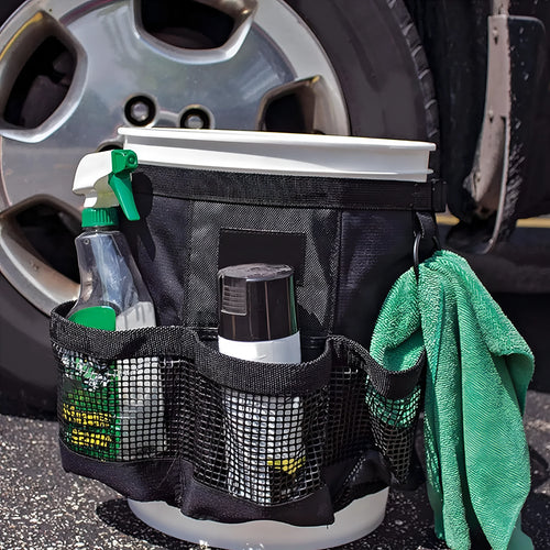 Black cylindrical polyester hanging storage bag on a 5 gallon drum
