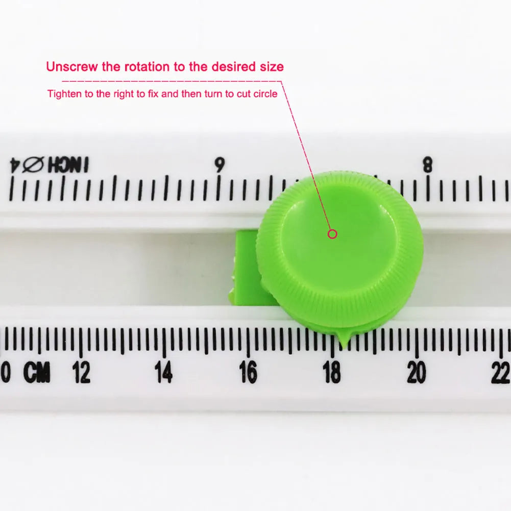 Green and orange plastic round paper cutter for A3 sheets on a colour box.