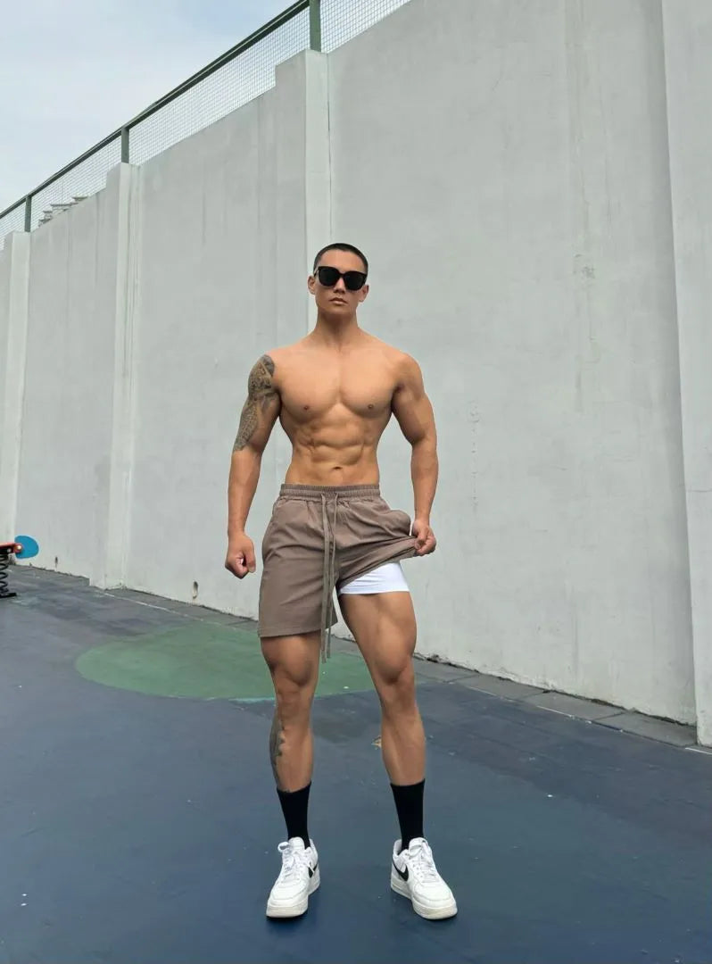 Men's ice silk quick-drying double-layer shorts in six colour options with quarter-length design