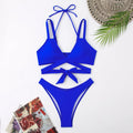 Women's solid colour strappy bikini swimsuit on a hanger, shown in briefs style.