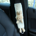 Cartoon plush lamb wool seatbelt shoulder protector in bear and rabbit designs.