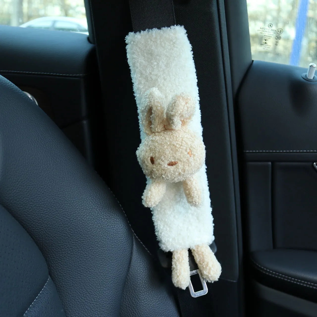 Cartoon plush lamb wool seatbelt shoulder protector in bear and rabbit designs.