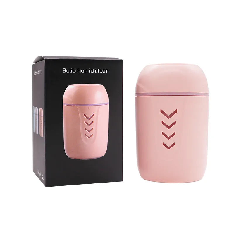 Blue columnar car humidifier with USB cable and mechanical controls on dashboard