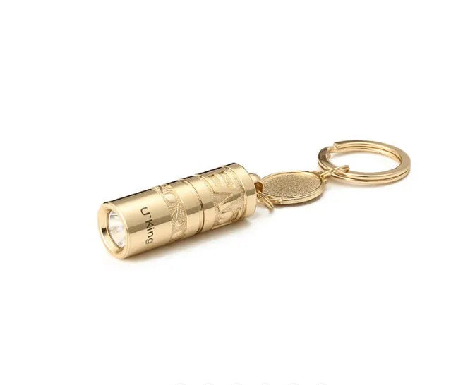 Gold zinc alloy waterproof mini LED flashlight attached to a keychain ring.