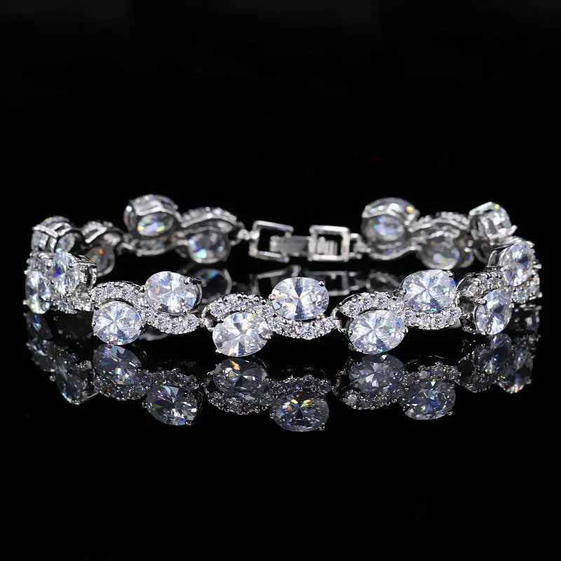 Geometric gold electroplated women's bracelet with inlaid zircon stones, shown in one of five colour options.