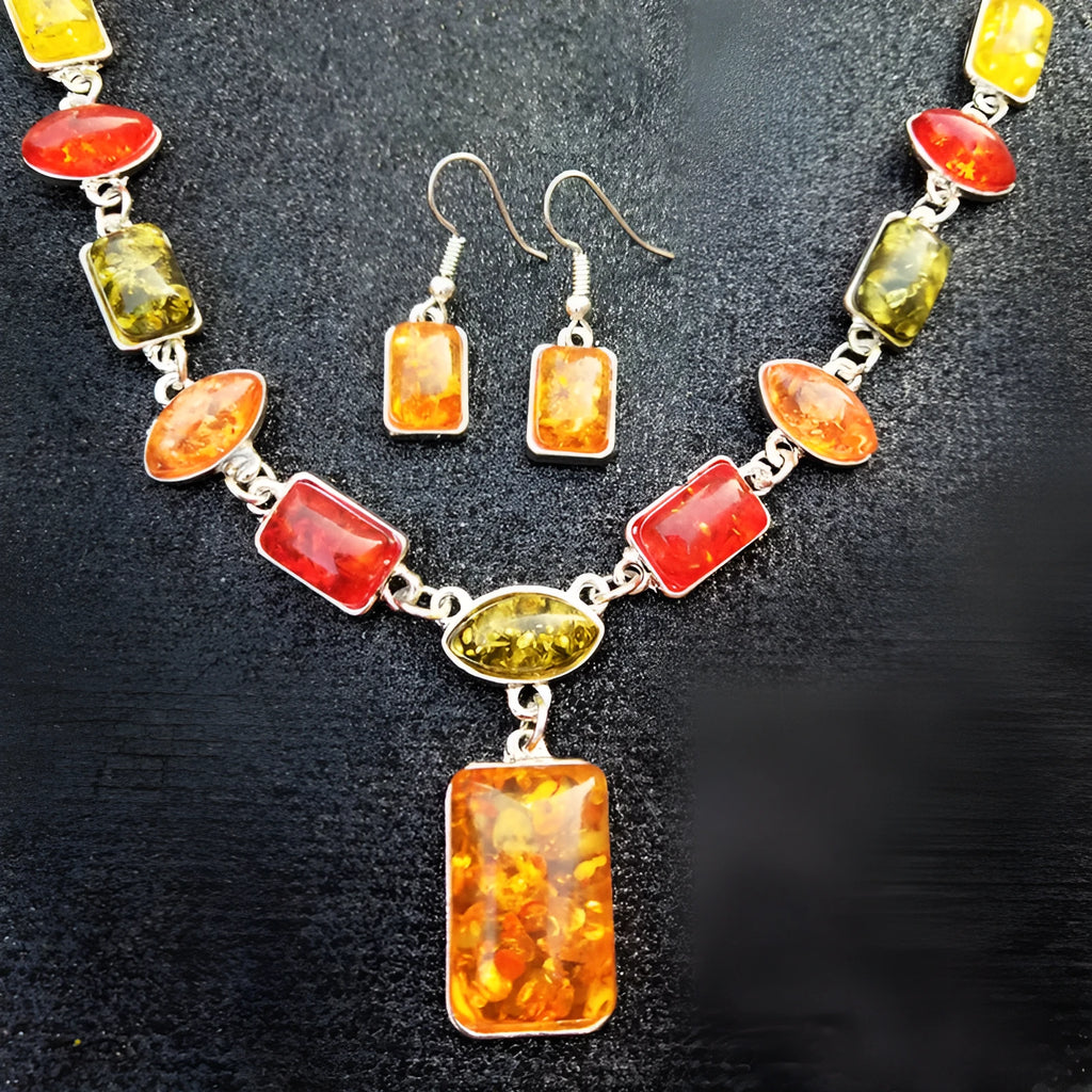 Two-piece jewellery set with alloy electroplated white pendant necklace and earrings featuring artificial gems.