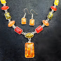 Two-piece jewellery set with alloy electroplated white pendant necklace and earrings featuring artificial gems.