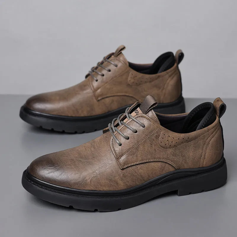 Men's black and brown leather casual sneakers with rubber soles and sewn detailing