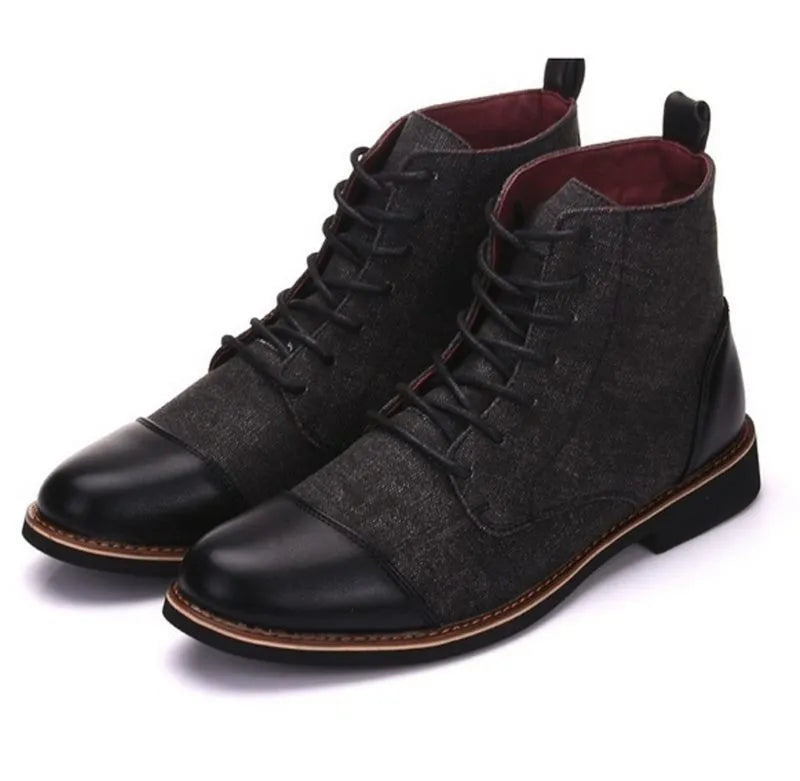 Men's black leather motorcycle-style boots with silver belt buckles on the side, featuring a thick rubber sole.