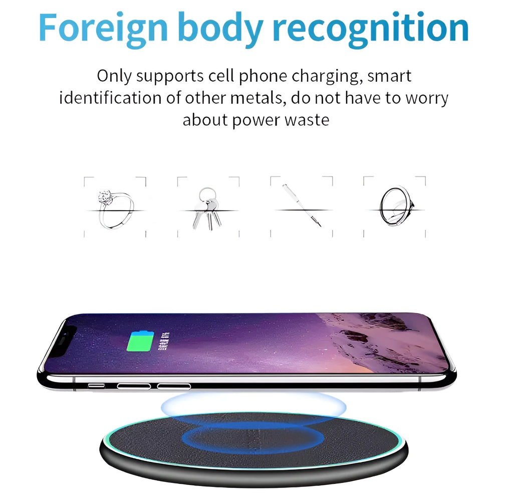 Black Quick Qi wireless charging pad for iPhone 11 on a desk surface