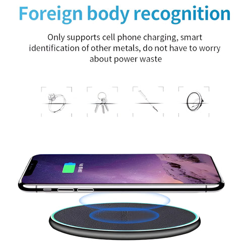 Black Quick Qi wireless charging pad for iPhone 11 on a desk surface