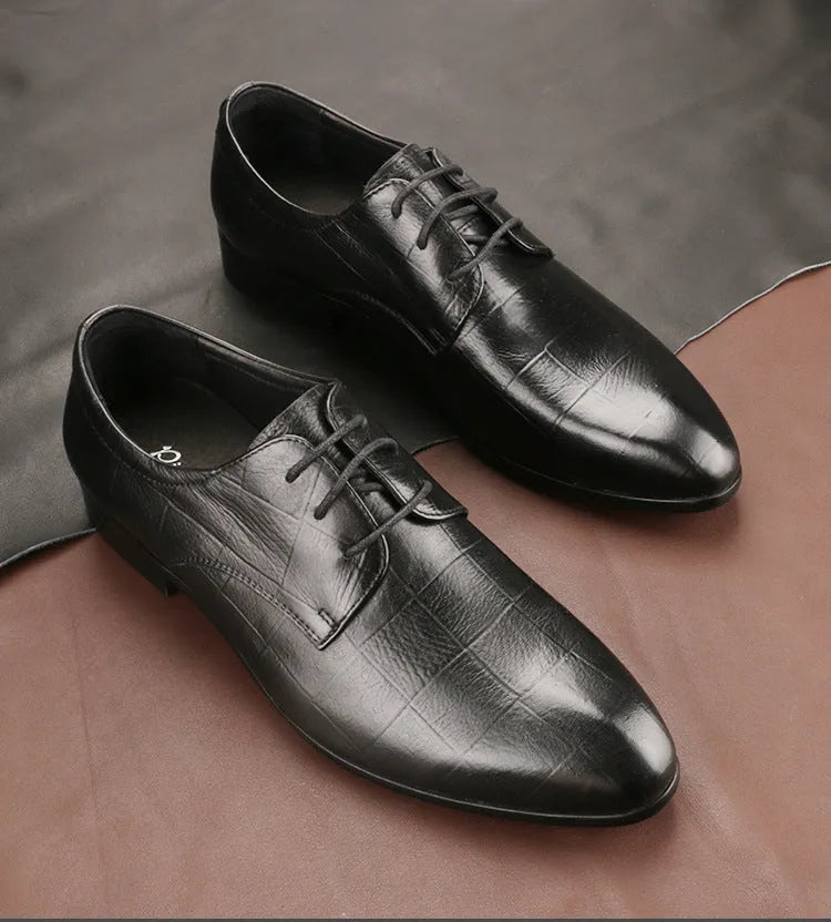 Men's black cow leather Derby shoes with pointed toe and rubber sole on a plain background