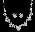 Bridal jewellery set with leaf design necklace and earrings featuring simulated pearls and cubic zirconia in silver white