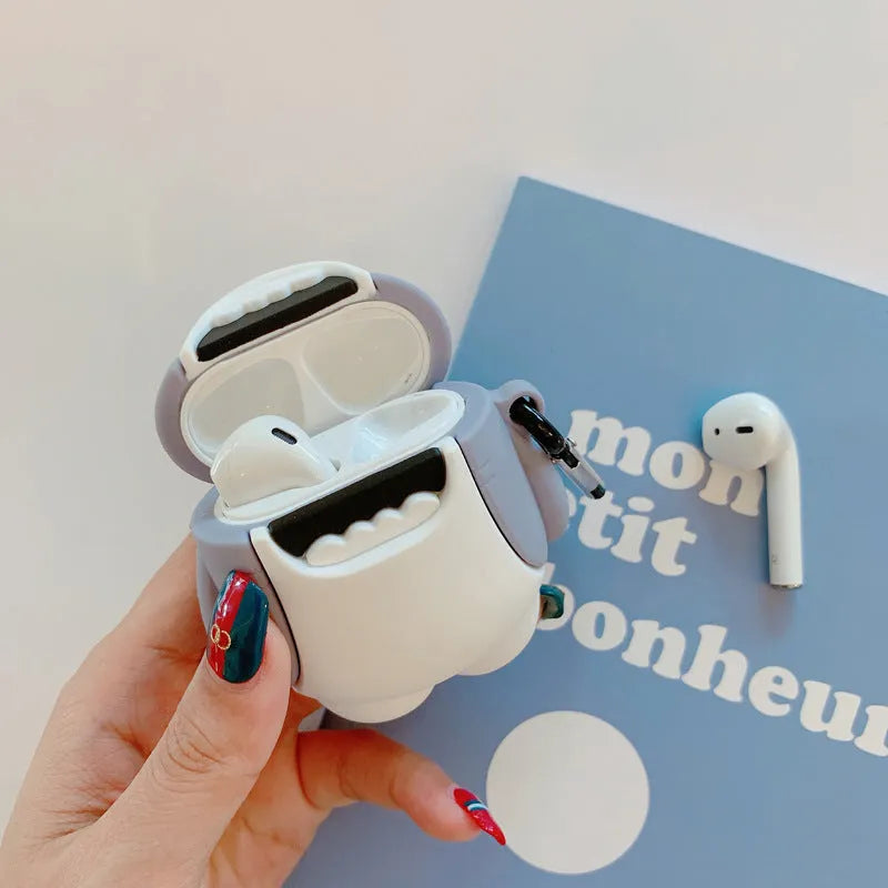 Silicone protective skin cover on a pair of white Apple AirPods 1 or 2 wireless earbuds.