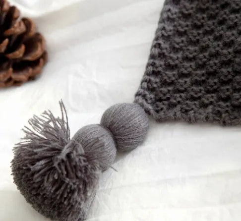 Nordic fringe knit ball blanket in beige colour on sofa, showing 130×170cm dimensions and fringe detailing.