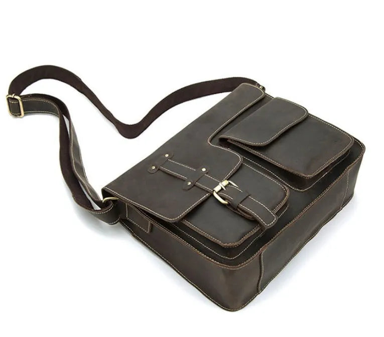 Leather vintage messenger bag in brown colour with adjustable strap and flap closure