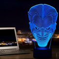 USB-powered 3D acrylic LED table lamp showing seven colour options on a desk