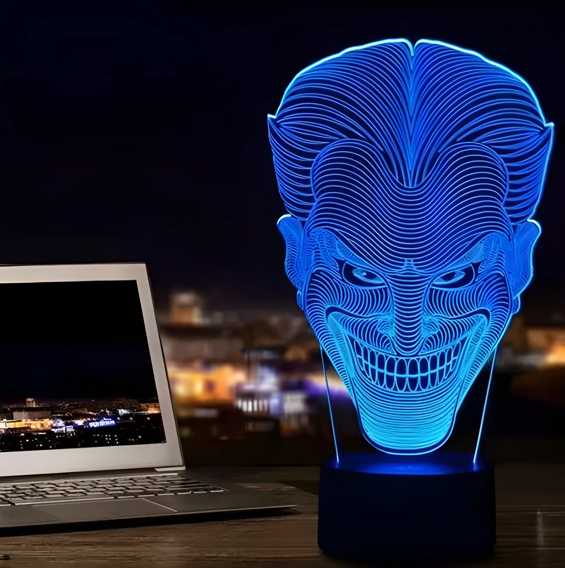 USB-powered 3D acrylic LED table lamp showing seven colour options on a desk