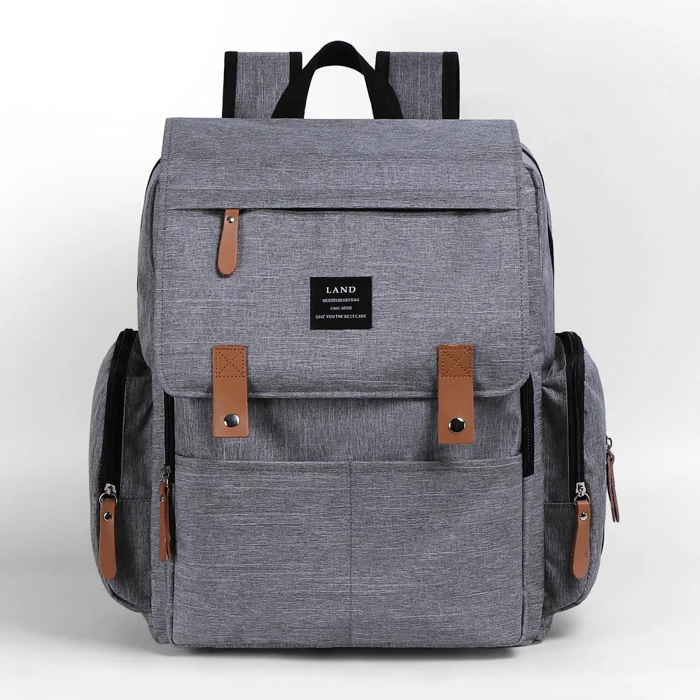 LAND Mommy Diaper Bag Backpack in oxford cloth with changing mat, shown in beige colour.