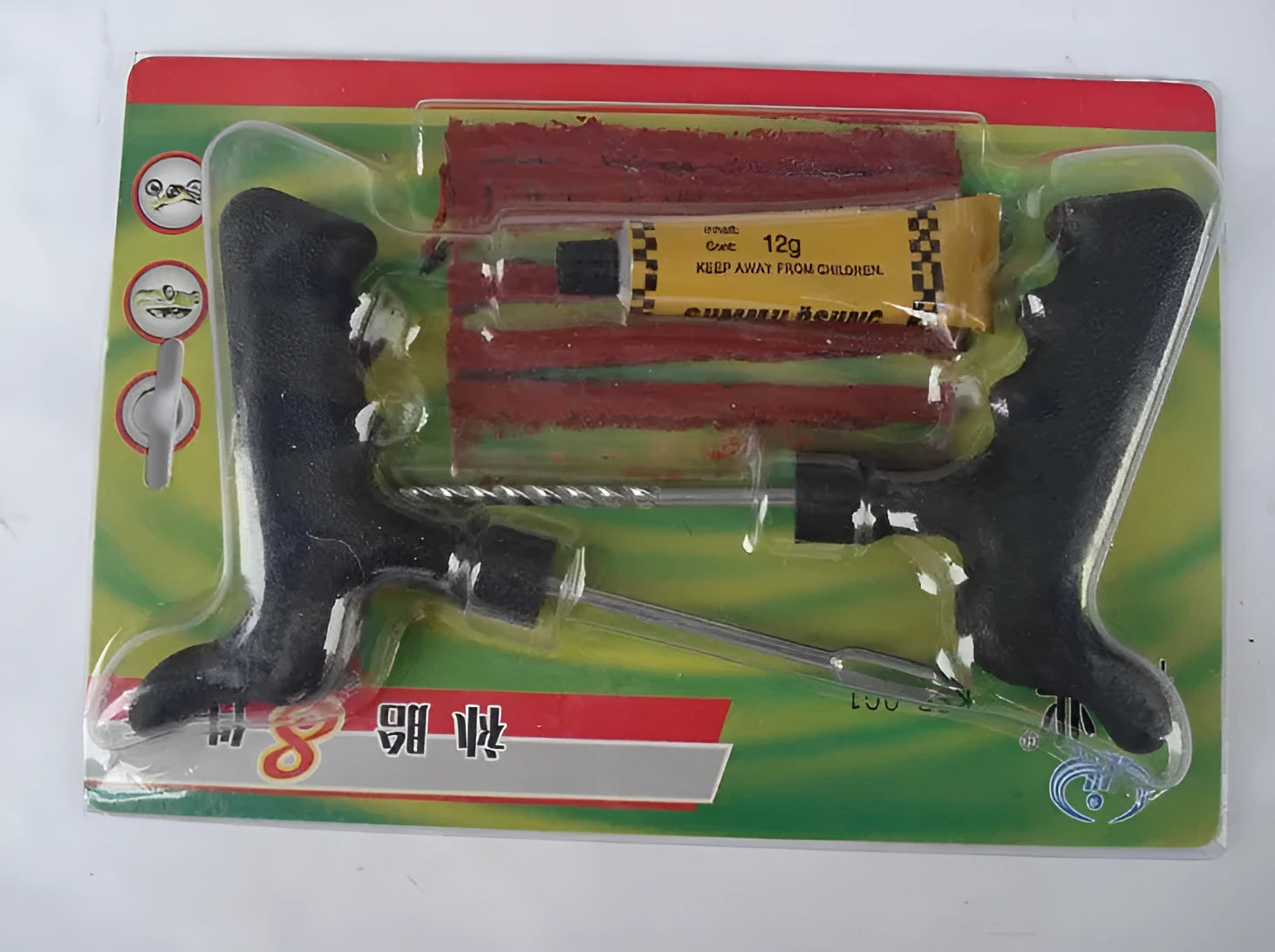 Vacuum tyre repair tool kit with probe, pin, glue and rubber strips in a black plastic case.