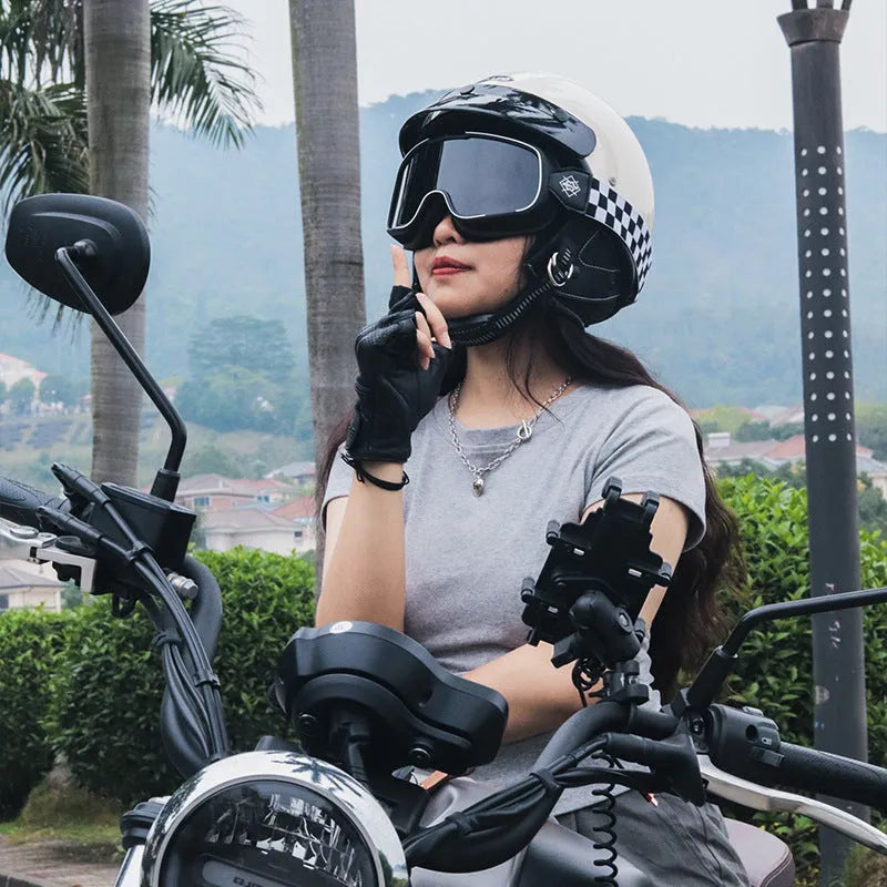 Retro full-face motorcycle helmet in cement grey on a stand