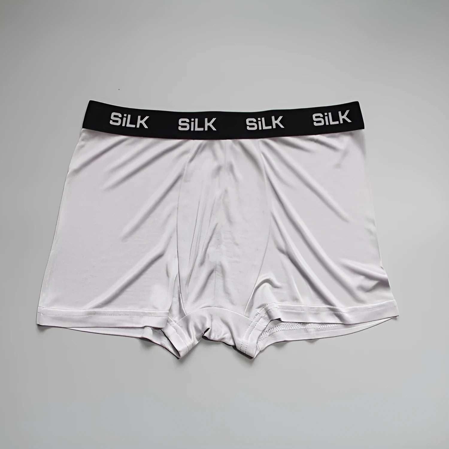 Men's loose fit silk shorts in navy blue colour showing mid waist design