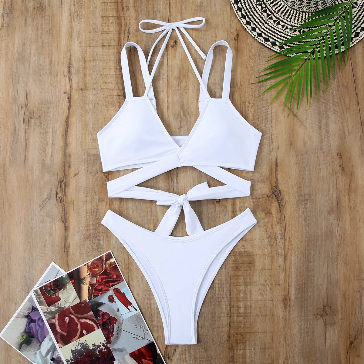 Women's solid colour strappy bikini swimsuit on a hanger, shown in briefs style.