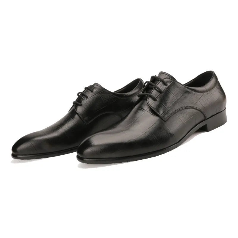 Men's black cow leather Derby shoes with pointed toe and rubber sole on a plain background