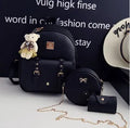 Women's 3-piece leather bag set with floral designs including backpack, shoulder bag and card wallet