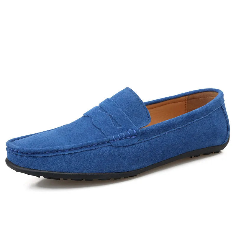 Men's solid colour suede leather slip-on loafers with a flat rubber sole.