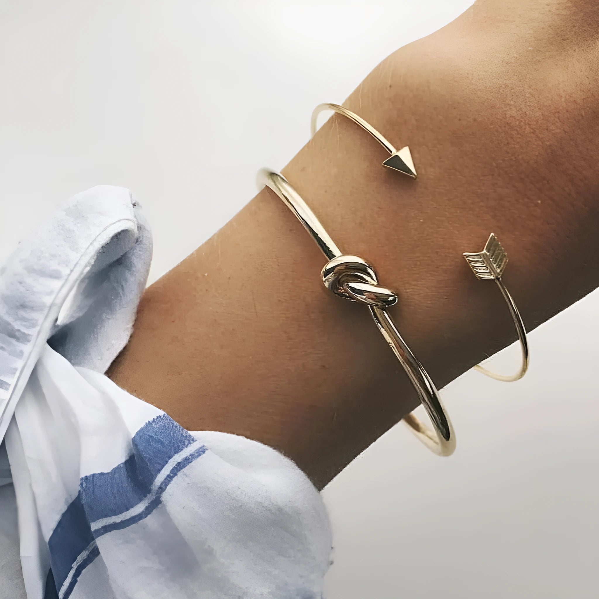 Gold electroplated alloy cuff bracelet with arrow and knot vintage design for women