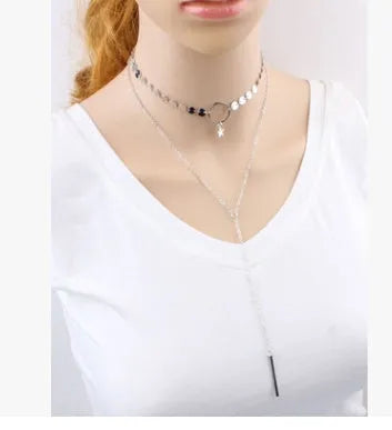 Star Goddess gold duo layering choker necklace on display