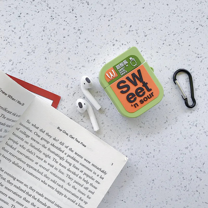 Green silicone case for AirPods 1/2 with a cartoon animal design on a white background.