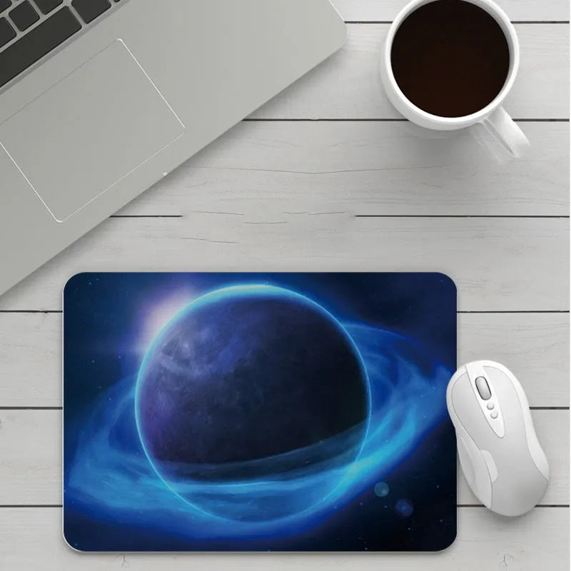 Custom cartoon thickening mouse pad on a desk, showing a colourful design with black stitched edge.