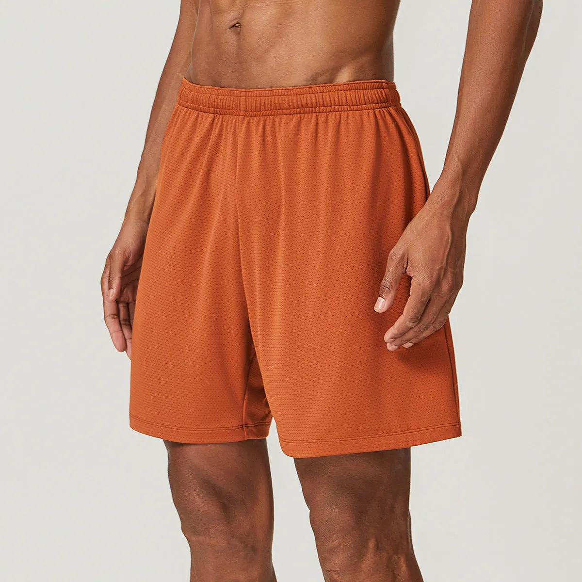 Men's quick-dry double-layer running shorts in various colours on a neutral background.